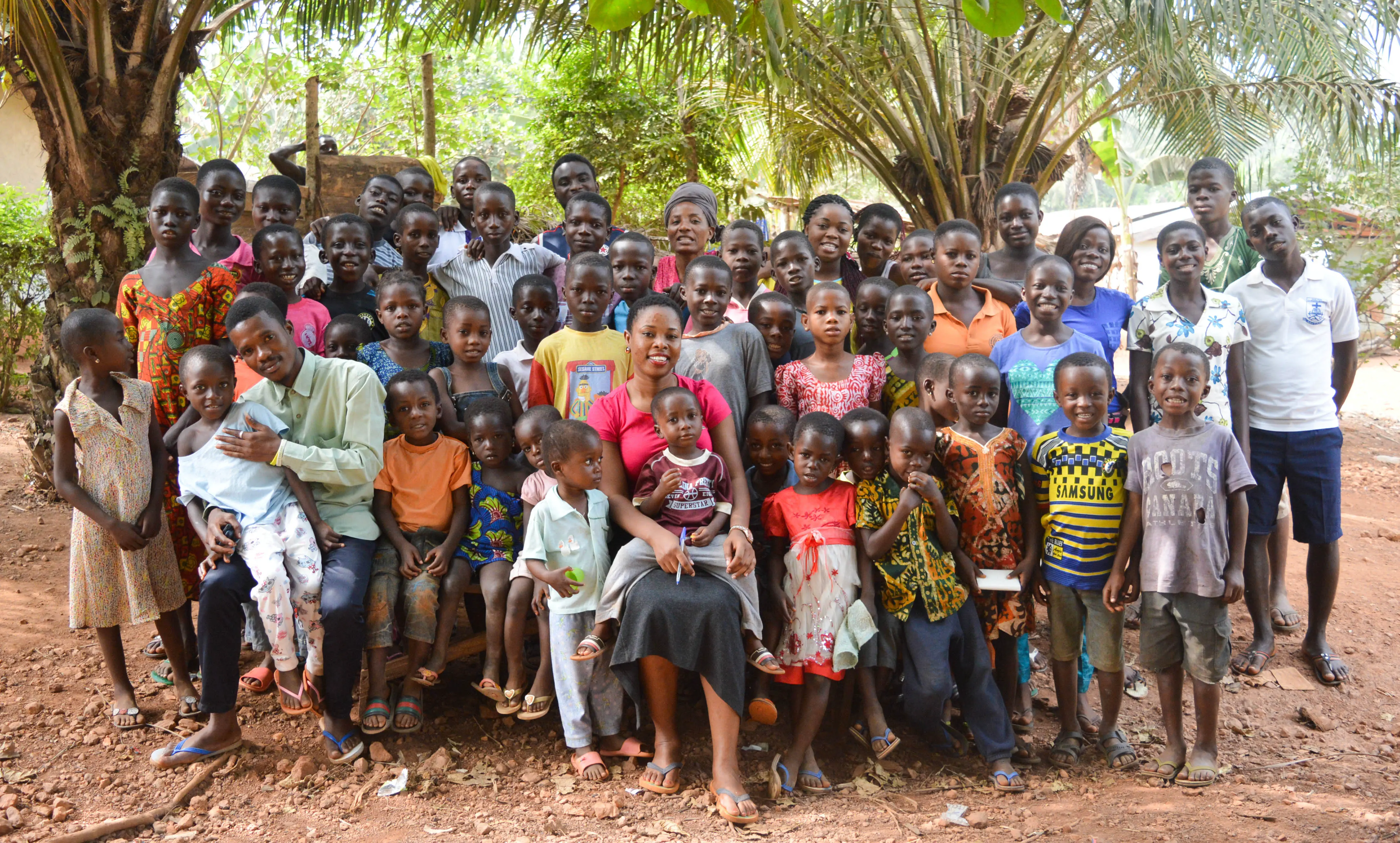 Volunteers and children working together